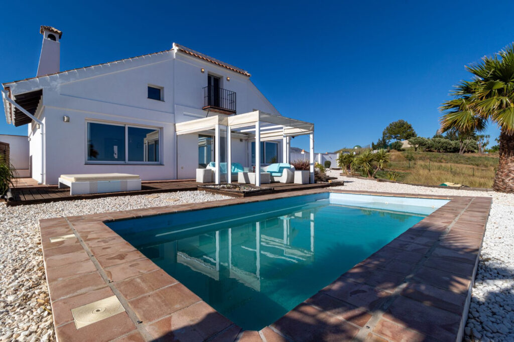 a pool in front of a house